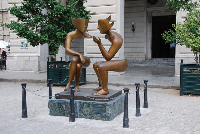 'The Conversation' a statue in Havana Cuba of two people sitting and talking